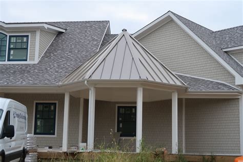 white house with a champagne metal roof|white metal roof interior ideas.